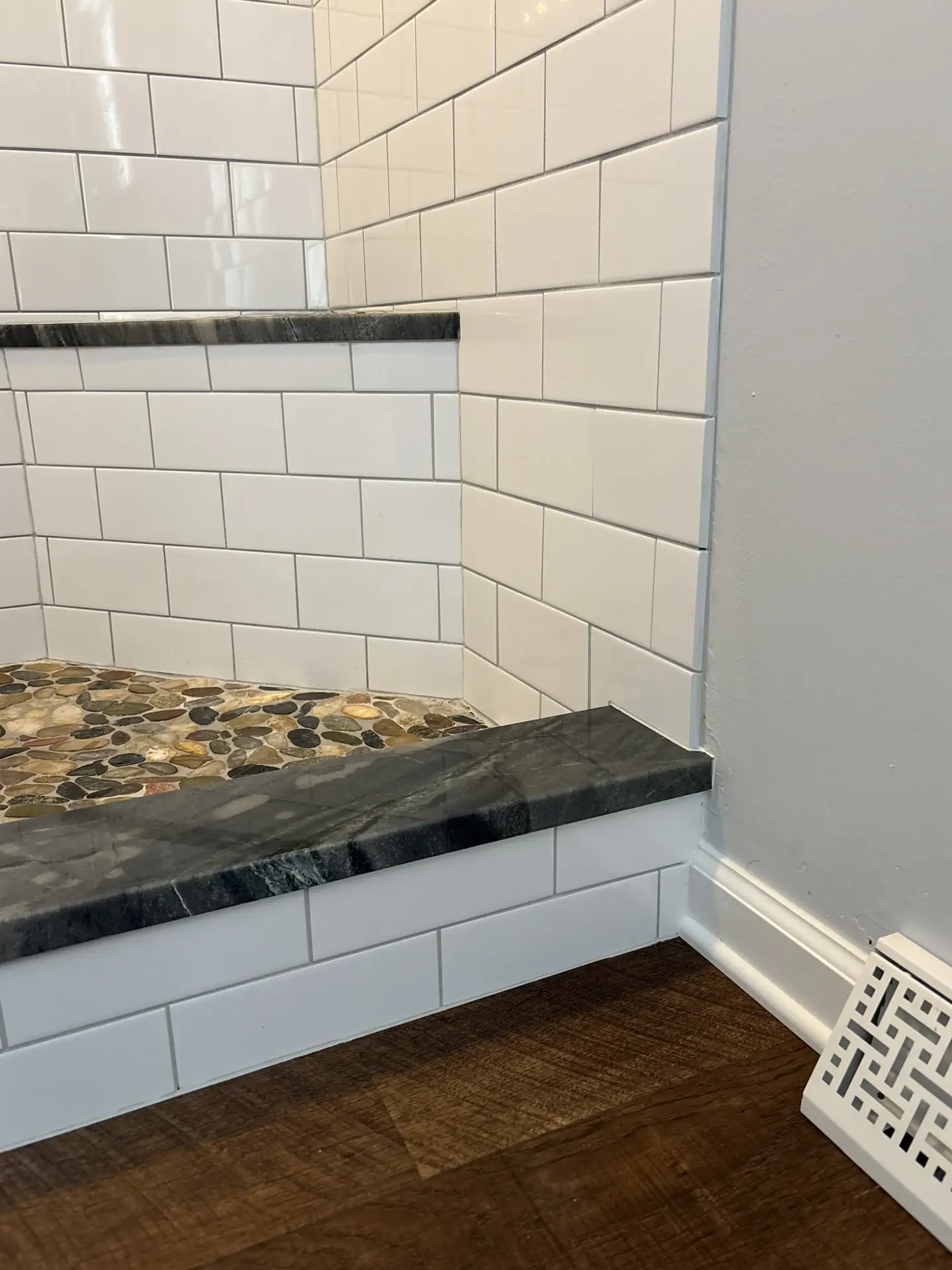 Shower curb with granite threshold